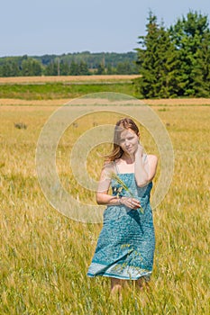 Young woman in summertime field