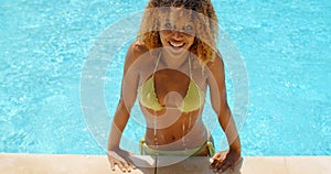 Young Woman Sun Bathing in The Pool