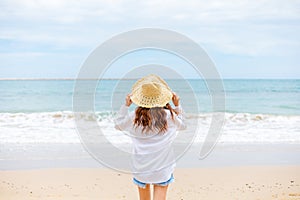 Young woman in sun hat on the  beach. summer, holidays, vacation, travel concept