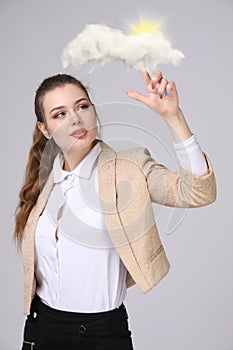 Young woman and sun shining out from behind the clouds, cloud computing or weather concept