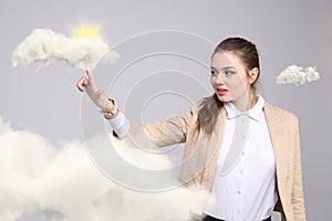 Young woman and sun shining out from behind the clouds, cloud computing or weather concept