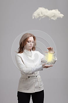 Young woman and sun shining out from behind the clouds, cloud computing or weather concept