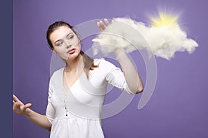 Young woman and sun shining out from behind the clouds, cloud computing or weather concept