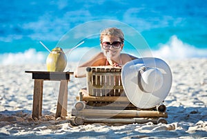 Young woman sunbathing on the beach