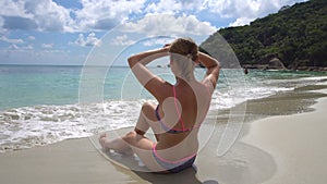 Young Woman Sunbathing on Beach