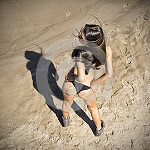 Young woman sunbathing in bikini