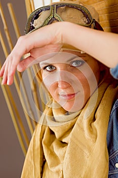 Young woman sunburned face with pilot goggles photo