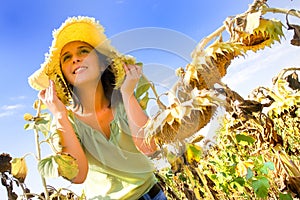 Young woman in a sunflower field