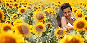 Young woman in the sunflower field