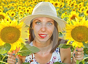 Young woman in sunflower field