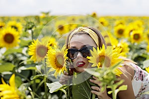 Young woman on a sunflowers field