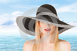 Young woman in sunhat