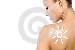 Young woman with suntan lotion