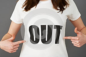 Young Woman Supporter Wearing T Shirt Printed With OUT Slogan