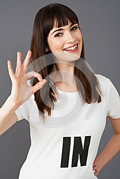 Young Woman Supporter Wearing T Shirt Printed With IN Slogan