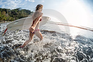 Young woman with surfboard