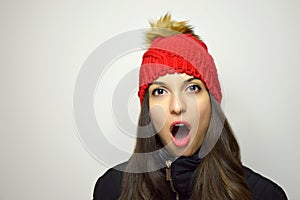 Young woman surprised for cheap price on Black Friday. Copy space.