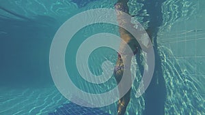 Young woman swimming in pool