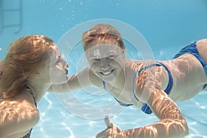 Young woman swimming Under water