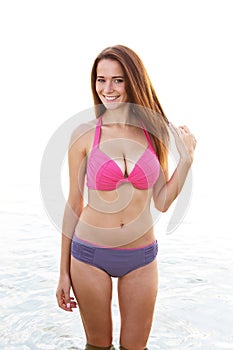 Young woman in a swimsuit in the sea water