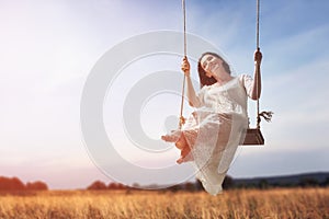 Young woman on a swing