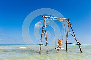 Young woman on swing Phu Quoc