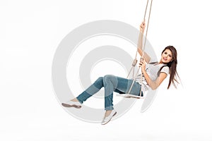 Young woman swinging