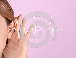 Young woman with symptom of hearing loss photo