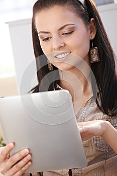 Young woman with tablet PC smiling