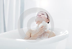 Young woman take a bath in bathtub