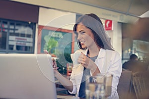 Young woman take a break. She drink a coffee.