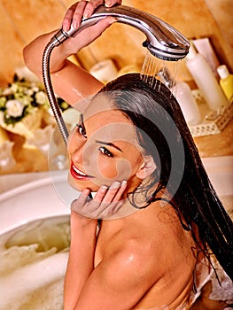 Young woman take bubble bath.