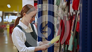 Young woman takes washcloth for cleaning house closeup