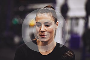 Young woman taking a break from her gym workout