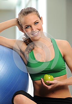 Young woman taking a break during workout