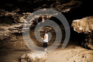 Young woman taking climbing lessons