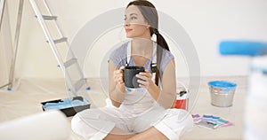 Young woman taking a coffee break