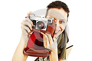 Young woman taking a picture with an old camera