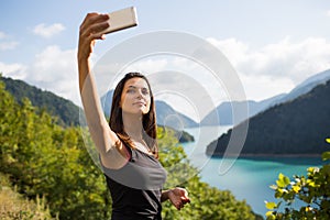 Young woman taking pictures on the phone