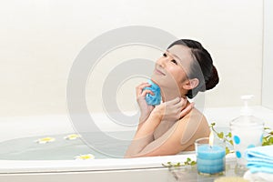 Young woman taking relaxing bath