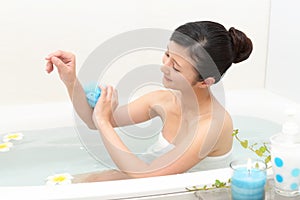 Young woman taking relaxing bath