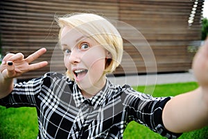 Young woman taking selfie