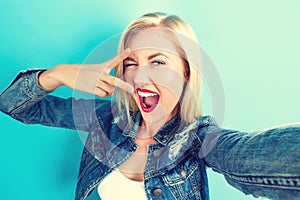 Young woman taking a selfie photo