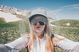 Young Woman taking selfie photo in mountains