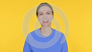 Young Woman Talking on Online Video Call on Yellow Background