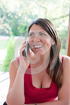 Young woman talks on phone