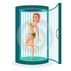 Young woman tanning in vertical solarium