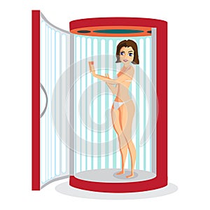 Young woman tanning in vertical solarium.