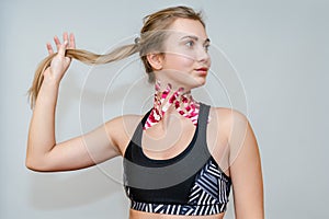 Young woman with tape for a facelift with kinesio. Esthetic taping. Salon procedures