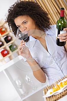 Young woman tasting wine